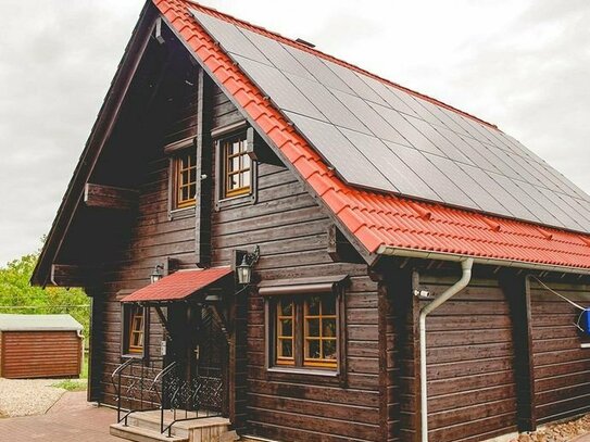 Modernes Holz-Blockbohlenhaus mit großem Grundstück (ehem. Gärtnerei)