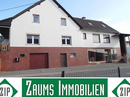 Zweifamilienhaus mit Ausbaufläche und ehemaligem Ladenlokal (Wintergarten, 2 Terrassen, Nebengebäude und Garage)