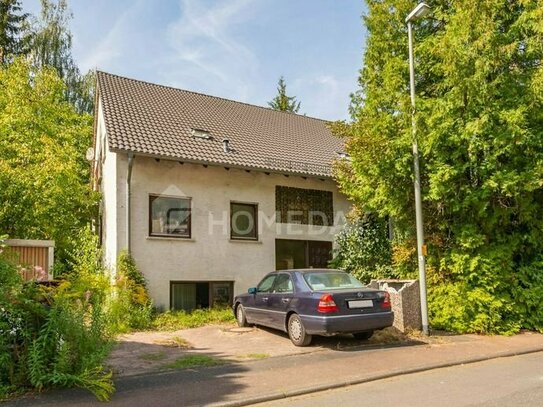 Massives Einfamilienhaus mit Einliegerwohnung, Garten und 3 Balkons in Birlenbach
