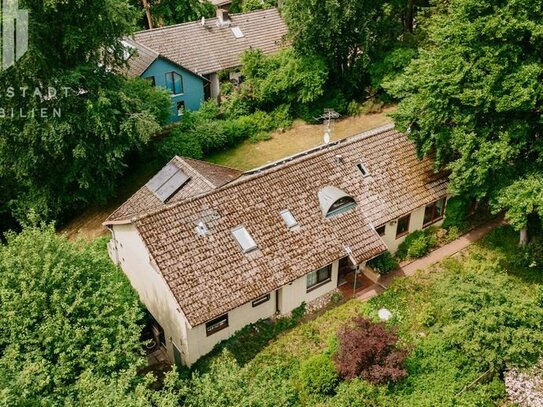 Ein Haus viele Möglichkeiten! Ein- oder Zweifamilienhaus in schöner Lage mit großem Grundstück in Hanglage