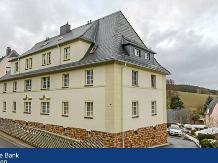 Exklusives Mehrfamilienhaus mit zeitlosem Charme und modernem Wohnkomfort.