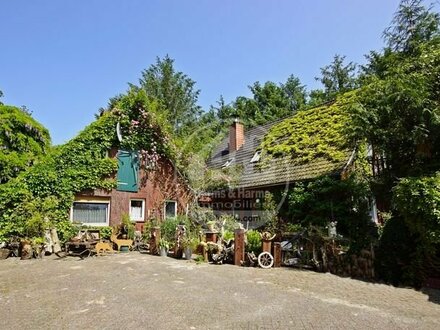 Wohnen direkt am Kanal: Einfamilienhaus mit idyllischem Garten