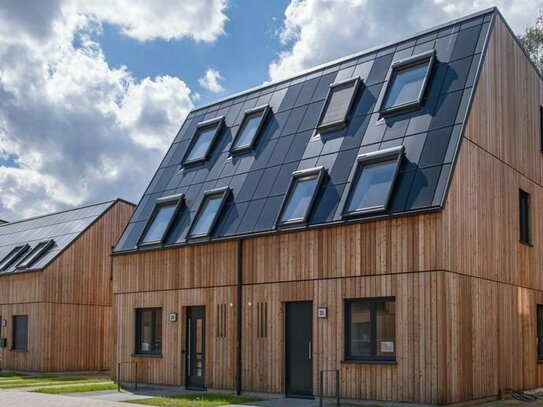 Ökologische Bauweise trifft stilvolle Gemütlichkeit: Doppelhaus in Französisch Buchholz