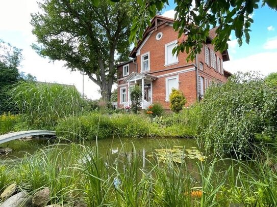 Charmantes Zweifamilienhaus mit idyllischem Gartenbereich!