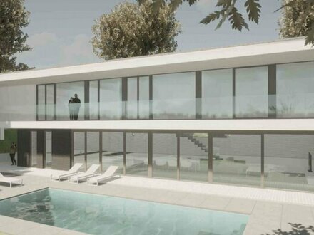 Harmonie zwischen Luxus und Natur – Neubau einer Modernen Villa mit Pool und Gartenblick am Hang