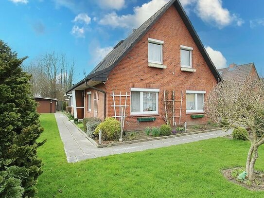 Neuenkirchen: Einfamilienhaus mit Einliegerwohnung, großem Garten, Garage und Wintergarten