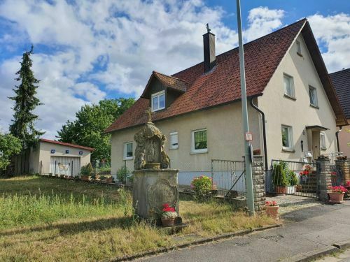Werneck - Ortsrandlage! Gepflegtes Einfamilienhaus mit weiterer Wohnung in 97440 Werneck-Vasbühl, 23 Minuten von Würzbu…