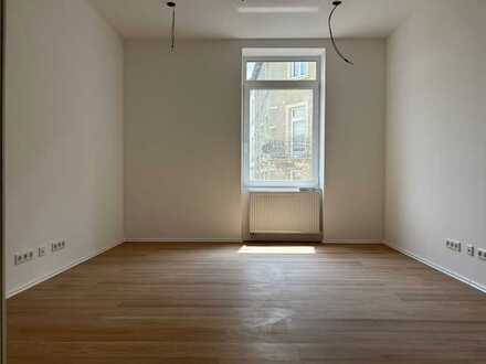 Schicke 1-Zimmer Wohnung mit Terrasse in Nähe der Uni im Erstbezug Zustand