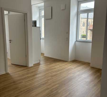 Erstbezug! Zentral gelegene 2 Zimmer Wohnung mit EBK und Stellplatz