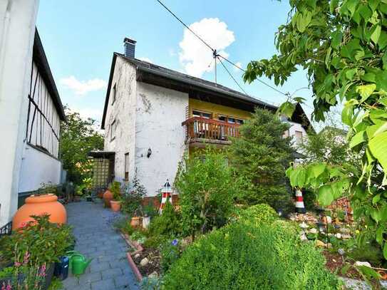 Idyllisches Einfamilienhaus mit großem Garten & Tiefgarage