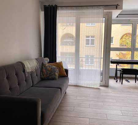 Furnished 1-bedroom apartment with balcony and shared garden