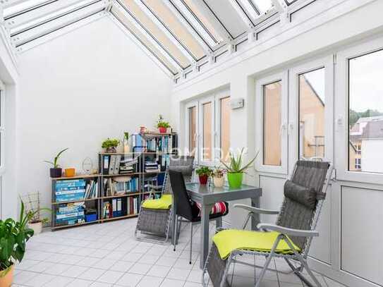 Helle Dachgeschosswohnung mit Wintergarten und Tiefgaragenstellplatz