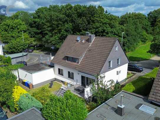 Großes Zweifamilienhaus mit drei Garagen, großer Dachterrasse und tollem Südgarten in Top-Lage in H