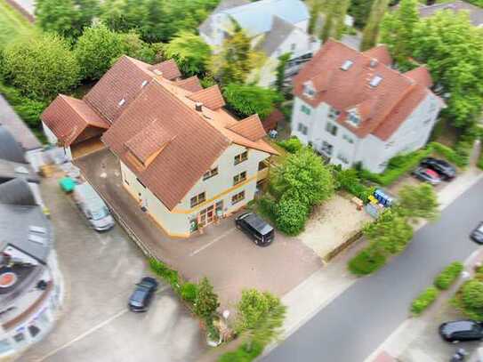 Vermietetes Wohn-/Geschäftshaus plus großzügiges EFH mit Garten in Feldrandlage von Bruchköbel