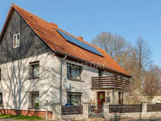 Zweifamilienhaus mit Terrasse und Südbalkon, Solarthermieanlage sowie Garage/ Werkstatt