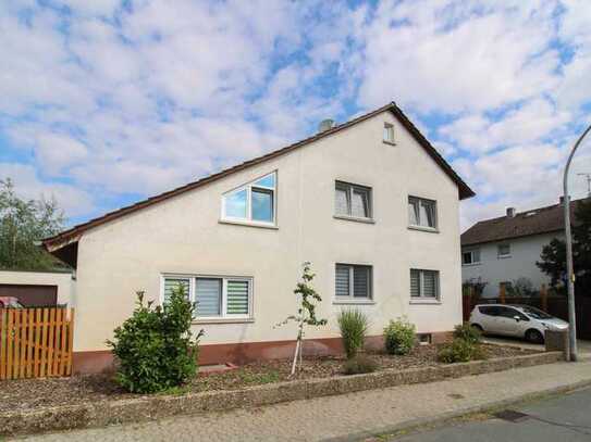 Einziehen und wohlfühlen: Charmantes Einfamilienhaus mit großem Garten, Terrasse und Garage