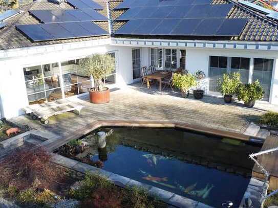 Exklusiver Bungalow mit Schwimmteich, High-End-Technik und Traumgarten in begehrter Lage von Krefeld