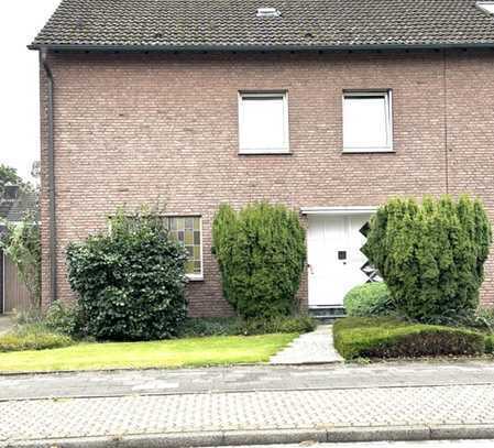 Modernisierte Doppelhaushälfte mit schönem Garten, Einbauküche und Garage in Kamp-Lintfort