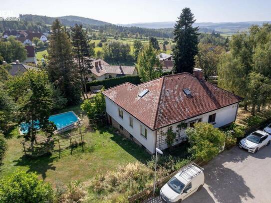 Großzügiges Einfamilienhaus mit parkähnlichem Garten im Zentrum