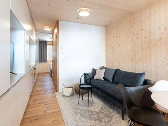 Erstklassiges Wohnen auf 33 m²: Moderne 2-Zimmer Vollholz Wohnung mit Balkon, Stellplatz und Fußbodenheizung in Au!