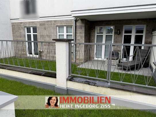 Moderne Erdgeschosswohnung mit Terrasse und kleinem Gartenanteil