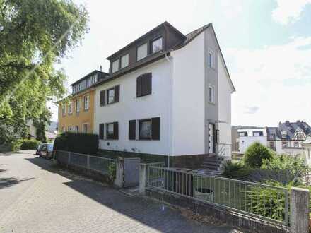 Attraktives Mehrfamilienhaus mit Garten und Stellplätzen in ruhiger Vorstadtlage