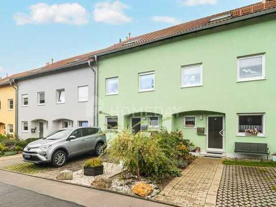 Familienidylle pur: Reihenmittelhaus mit sonnigem Balkon, Terrasse, Tiefgarage und 2 Stellplätzen