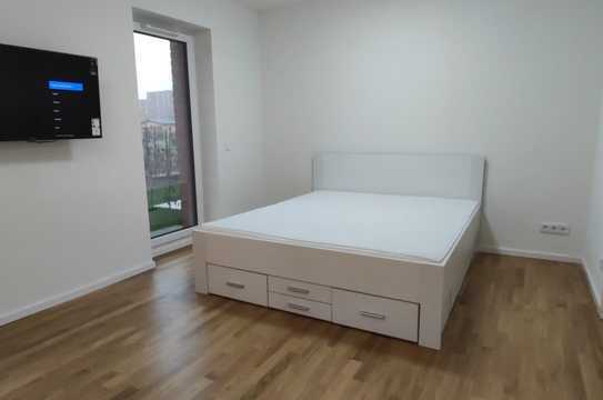 Möblierte 35 qm Neubauwohnung mit Süd-Terrasse und Garten