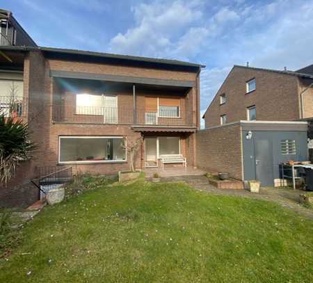 Modernisierte Doppelhaushälfte mit schönem Garten und Garage in Kamp-Lintfort