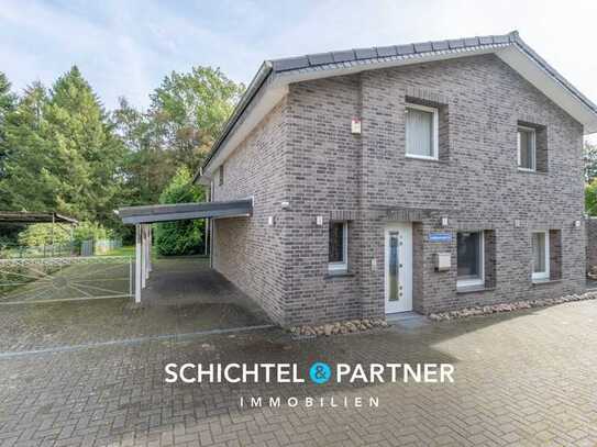 Ritterhude | Modernisiertes Einfamilienhaus mit Balkon, Terrasse und zwei Garagen in begehrter Lage