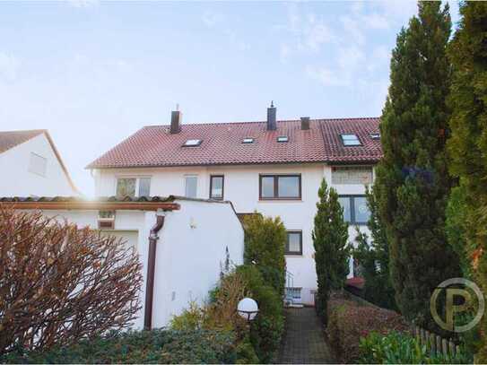 Reihenmittelhaus mit direkter Feldlage, Garage und Garten.