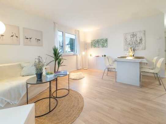 Neubau - Idyllisch, modern, gut angebunden: 2 Zimmer Wohnung mit EBK, Terrasse und Gartenanteil