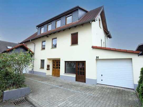 Modernes Einfamilienhaus mit Ladenfläche und Garten im Herzen Altenstadts