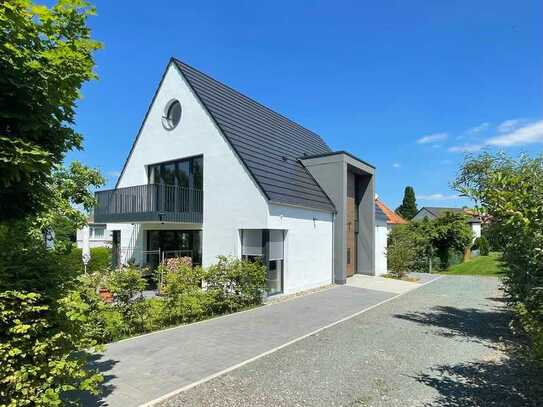 Sonnige Neubauwohnung mit eigenem Garten in bester Lage