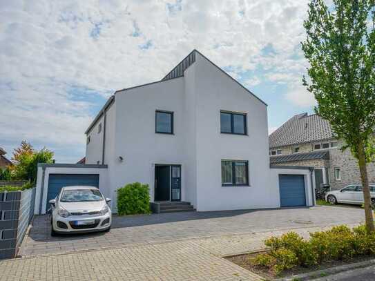 Erdgeschoss-Wohnung mit Garten und Garage