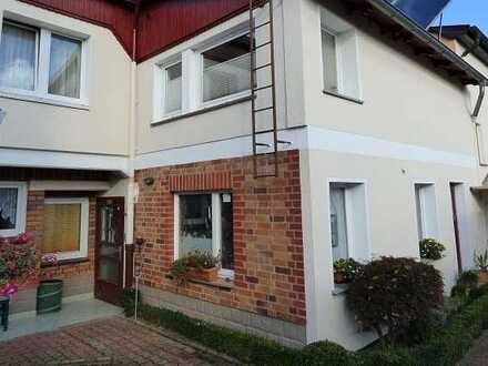 Mehrfamilienhaus mit Gewerbeeinheit und Gartengrundstück