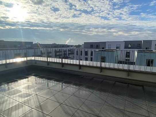 Effizientes Penthouse mit umlaufender Dachterrasse und Weitblick ins Grüne