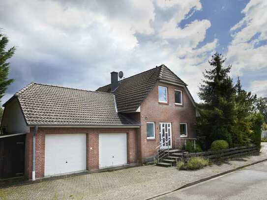 Wohnhaus mit Garten und Massivgarage in Isernhagen-Neuwarmbüchen