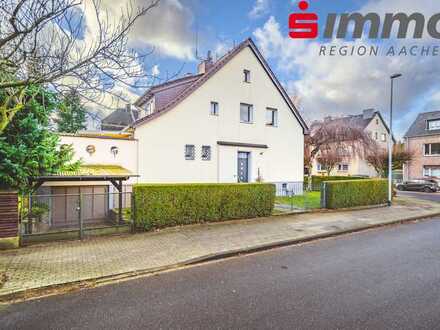 Gepflegtes Zweifamilienhaus mit Bauparzelle in gefragter Lage
