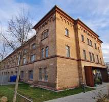 Modernes 1-ZKB Apartment trifft auf historischen Klinkerbau