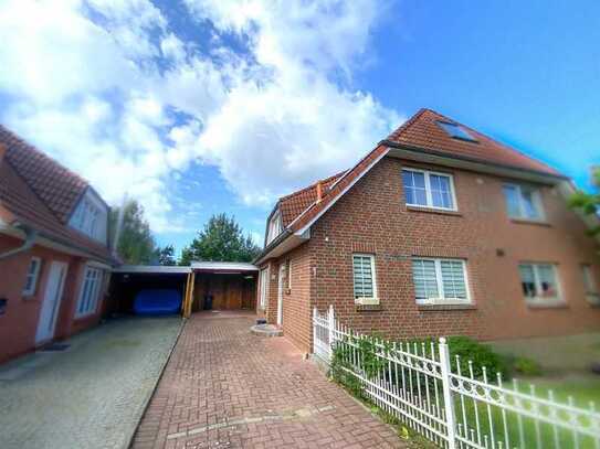 Moderne Doppelhaushälfte mit Photovoltaikanlage, Carport, Garten und weiteren erstklassigen E