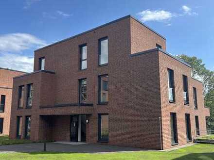 Exzellente & energieeffiziente EG-Wohnung in Inselvilla 04 mit Terrasse, Gartenanteil + TG!
