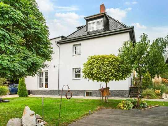 Modernisierte DHH mit Gartenparadies, Carport und Garage – Ihr neues Zuhause mit Ausbaureserve