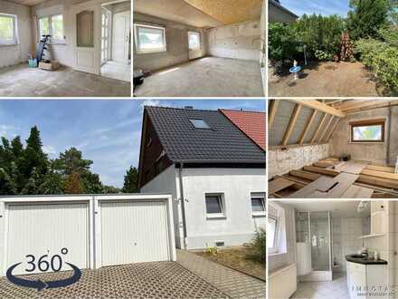 Doppelhaushälfte überwiegend im Rohbau mit neuem Dach und Doppelgarage in Gartenstadt