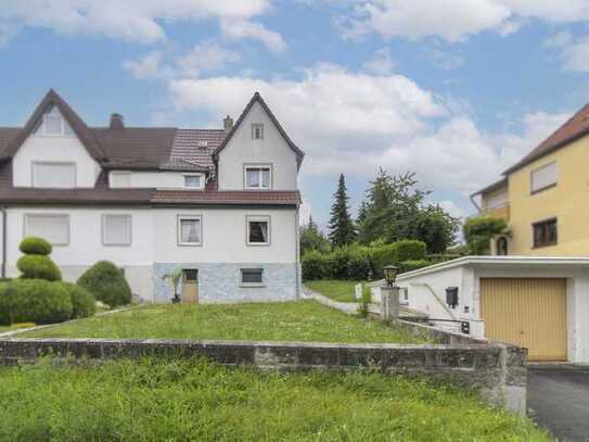 Home sweet home: DHH mit schönem Garten, Balkon, einer Garage und weiterem Gestaltungspotenzial