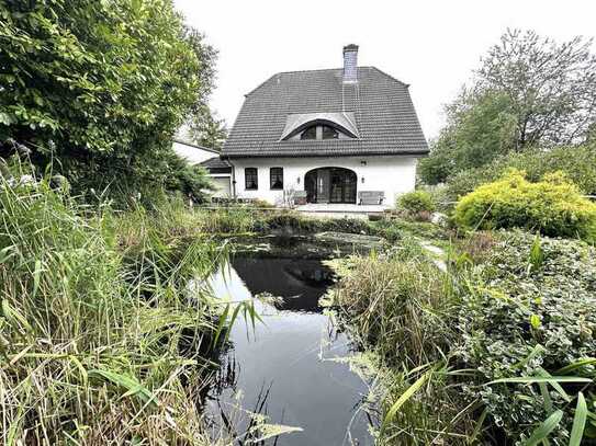 Für Gewerbetreibende: freistehendes EFH mit 106 m² Einliegerwohnung und Gewerbehalle in