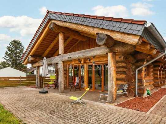 Ihr Traumhaus im Blockhausstil – Naturnahes Wohnen auf großzügigem Grundstück