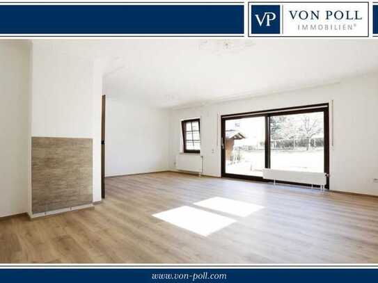 Lichtdurchflutete Erdgeschosswohnung mit Terrasse und eigenem Gartenanteil