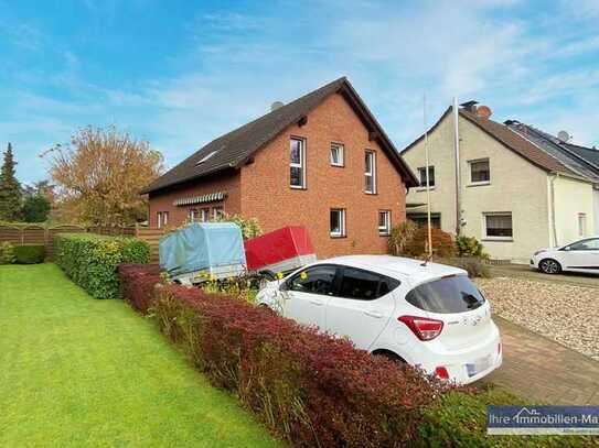 Stilvolles Wohnen auf zwei Ebenen mit eigenem Garten.