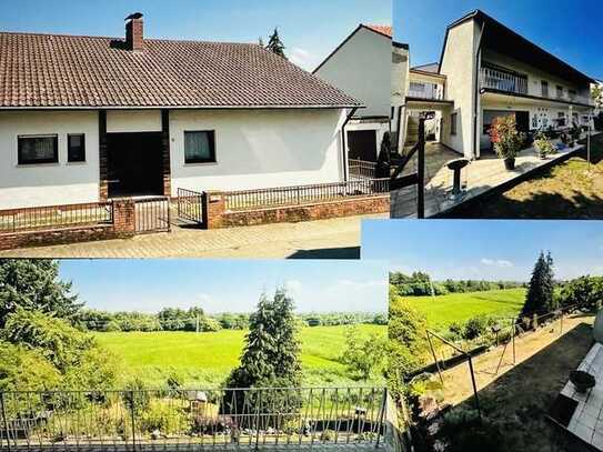 Einfamilienhaus mit toller Aussicht in die unverbaute Natur inkl. vermietete Einliegerwohnung